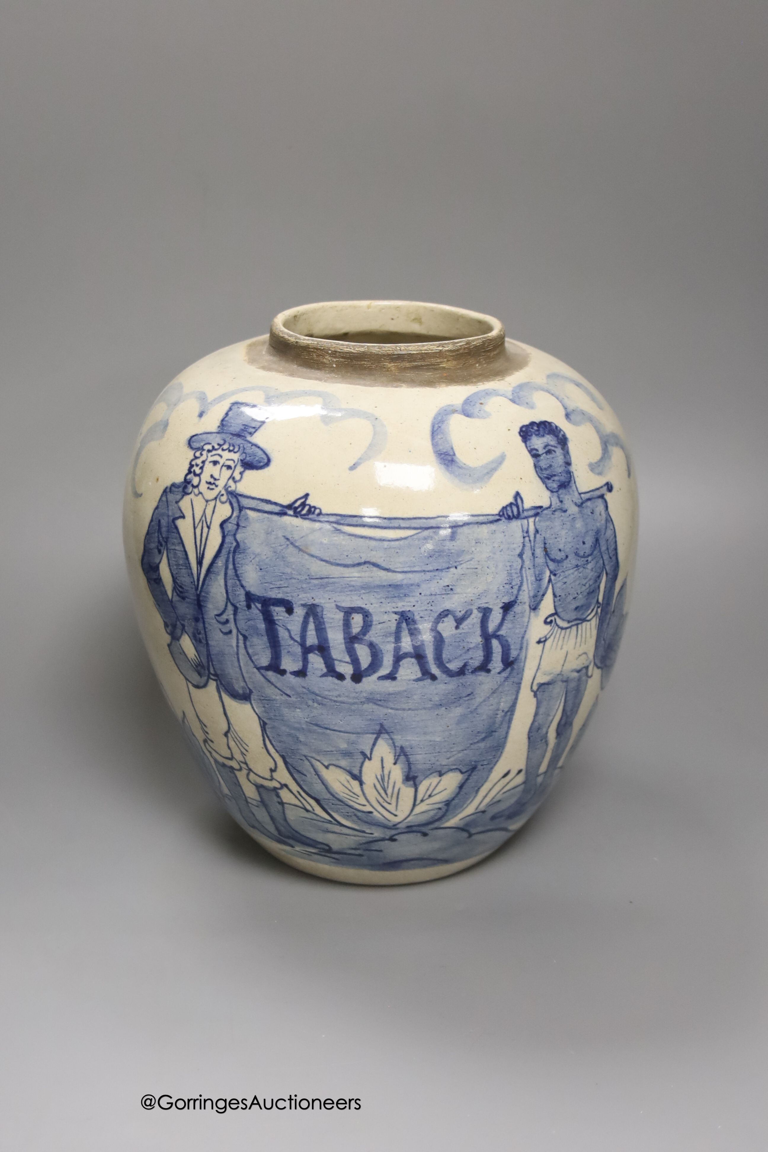 A tin-glazed terracotta barber's bowl dated 1819, a large ovoid eathenware ‘Taback’ jar and three earthenware jugs